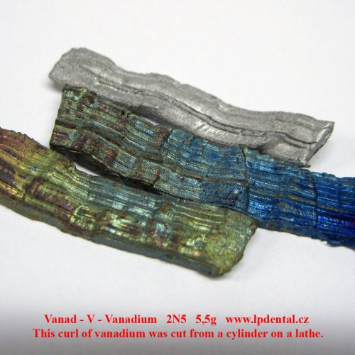 Vanad - V - Vanadium This curl of vanadium was cut from a cylinder on a lathe..jpg